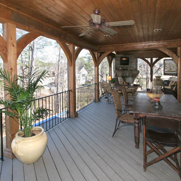 Rustically Rich And Wonderful Outdoor Living Archadeck Handsome Hand Carved Arches Grace The Exterior Frame Of This Beautiful Covered Deck Porch